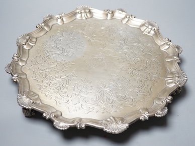 A late George II silver salver, with later engraved decoration, Ebenezer Coker, London, 1758, diameter 32cm, 25.5oz.